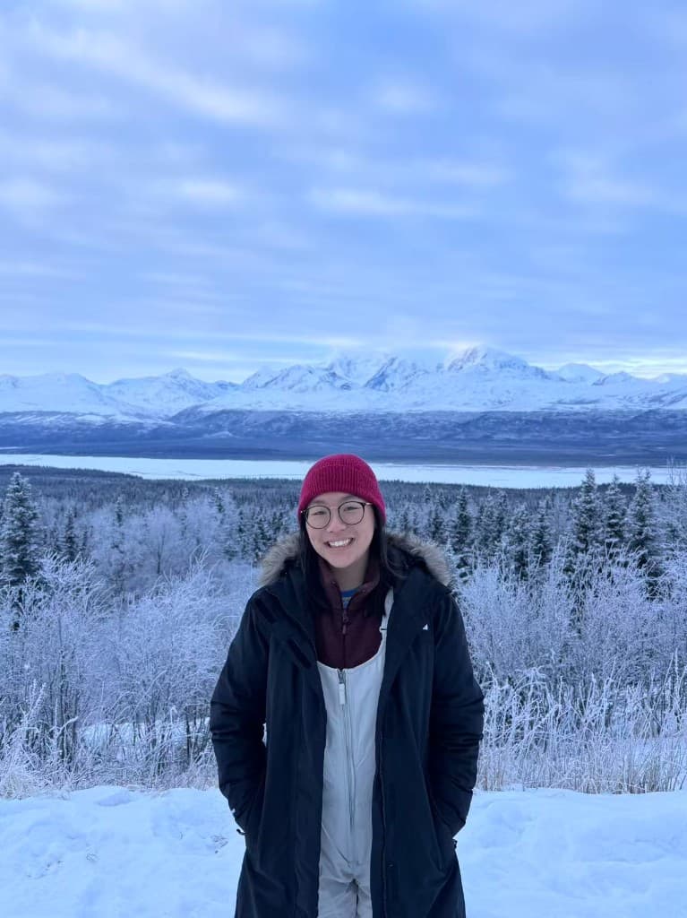 Portrait on the Dalton Highway with frosted trees and snow-covered mountains, Alaska